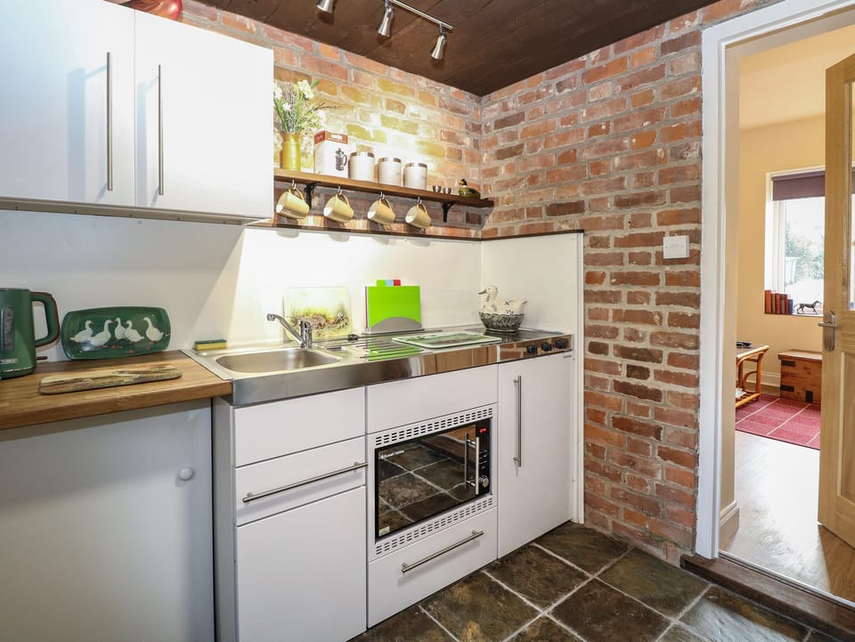 Fridge, electric kettle, toaster, cookware/dishes/utensils