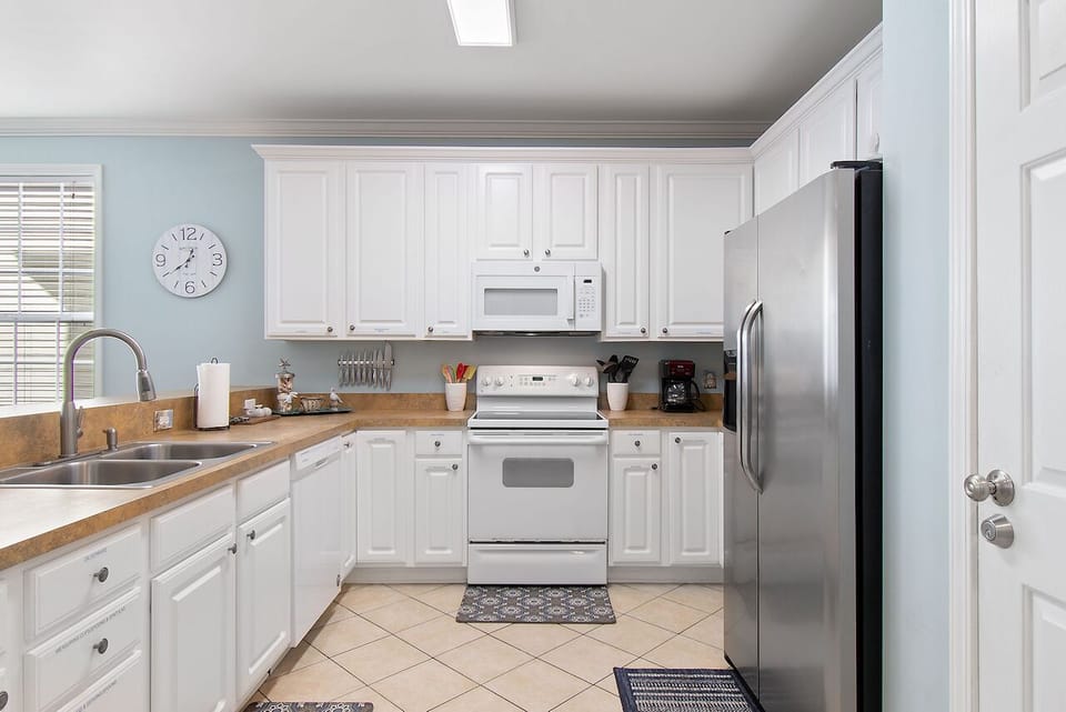 Your fully equipped kitchen awaits with stainless steel appliances, granite counters, and everything you need to create memorable meals.