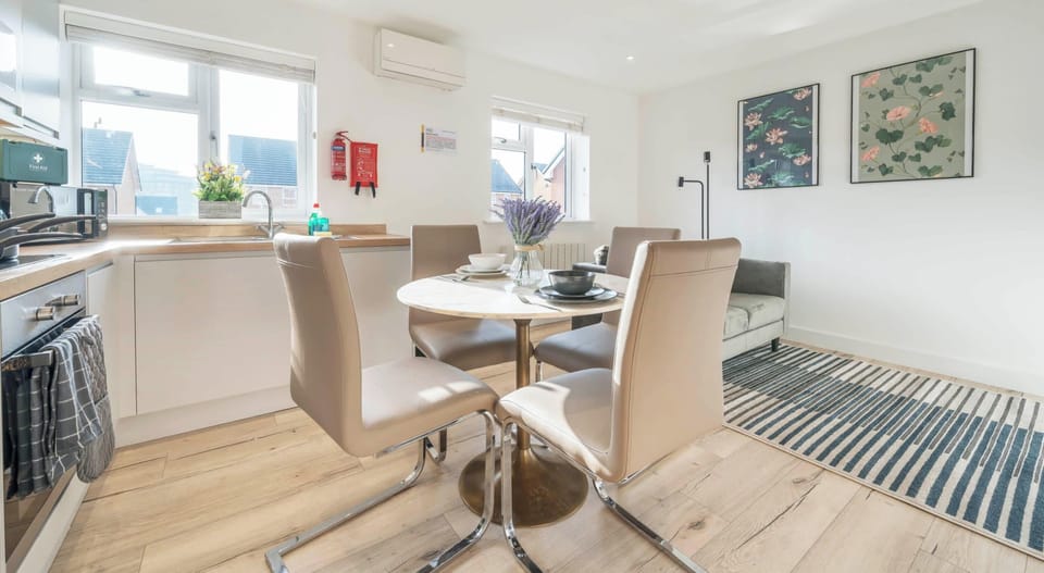 SLEEK AND MODERN KITCHEN AND DINING AREA