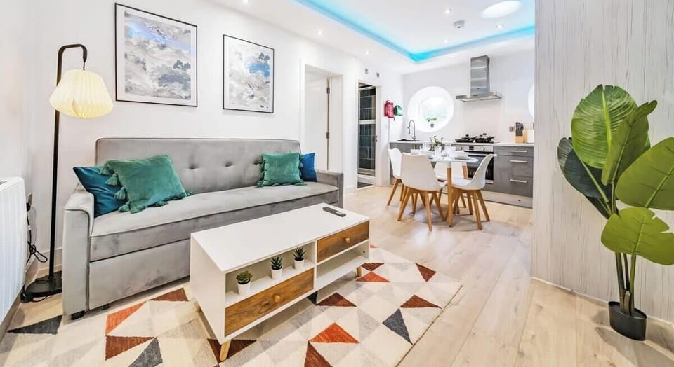 RELAX AFTER A HARD DAY IN THIS SPACIOUS LIVING AREA WITH A COMFORTABLE DOUBLE SOFA BED