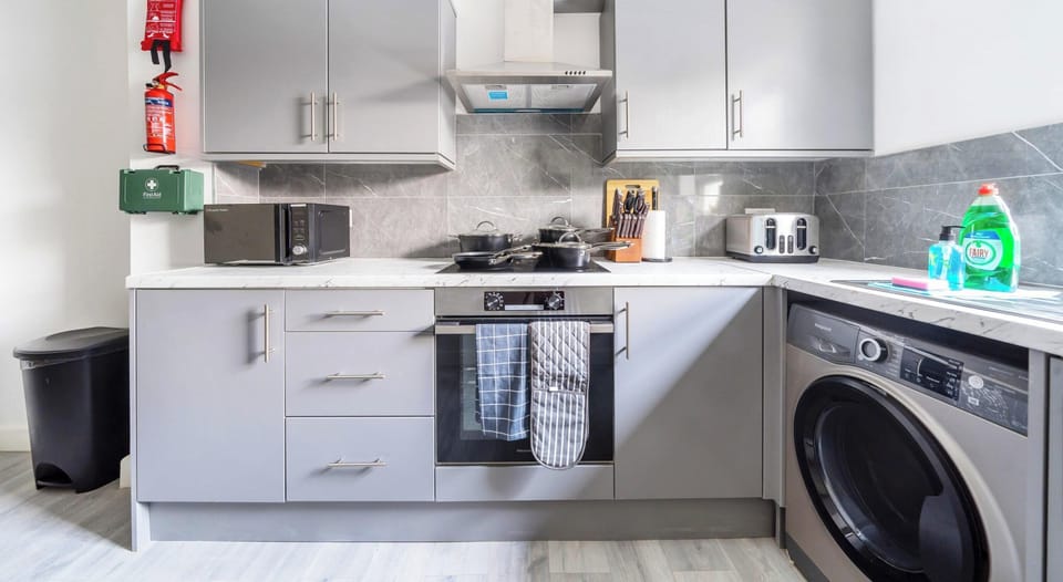 FULLY EQUIPPED KITCHEN WITH WASHER