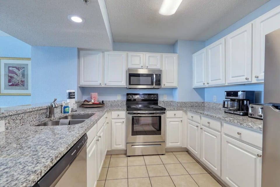 Full kitchen with stainless steel appliance