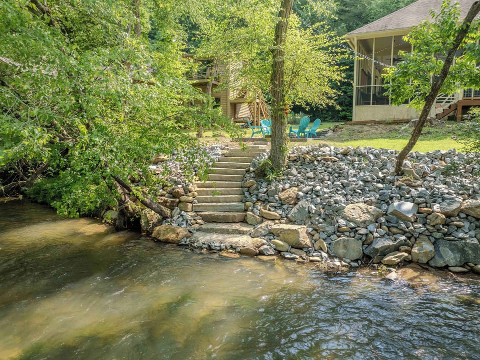 NEW stone stairway leading you right down to the river’s edge, where you can soak up the sights and sounds of the water. The perfect spot for fishing, wading, or simply enjoying the beauty of nature just steps from your door.