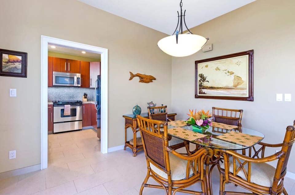 Gather around in island style, this tropical dining nook blends warmth, charm, and a fully equipped kitchen