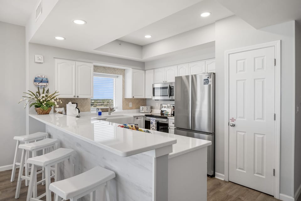 Cook meals in your fully stocked kitchen/home away from home with Gulf views!