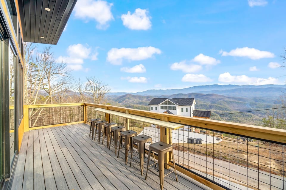 Sizzle and chill on our third-floor deck, featuring a propane grill and stunning mountain view!