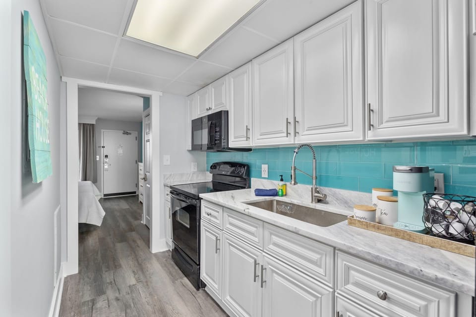 Kitchen drawers are fully stocked with all cooking essentials and cookware.