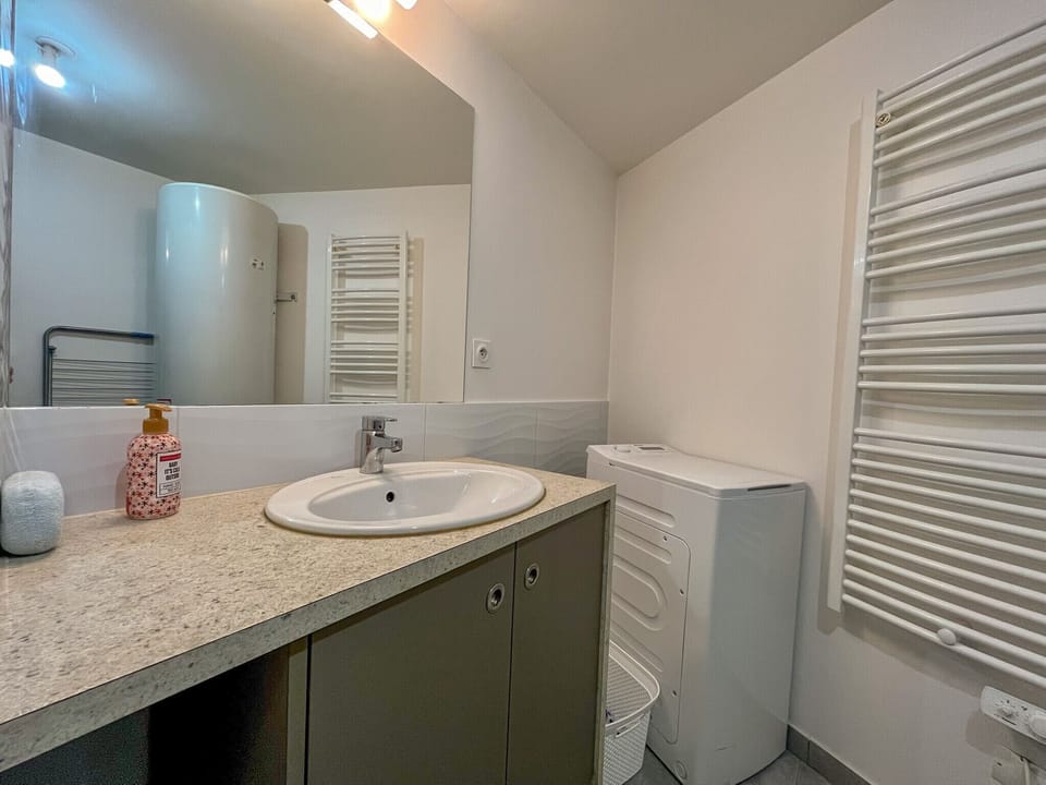 Bathroom with laundry machine