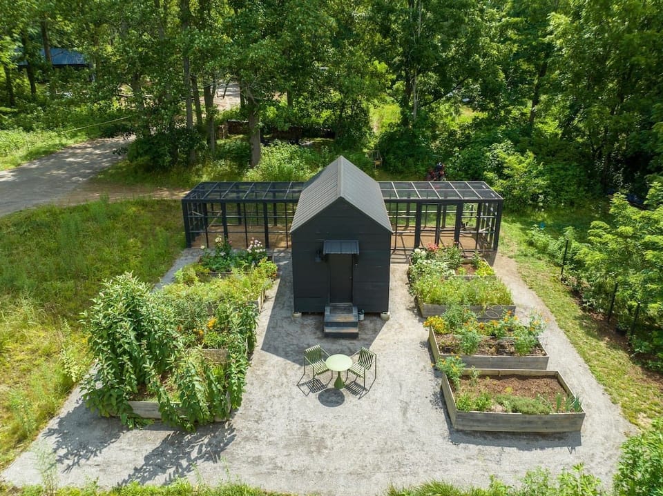 Explore the raised bed gardens and chicken coop. 