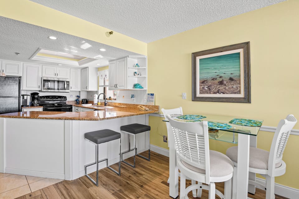Table has three higher swivel chairs for your convenience, and two bench seats at the counter.