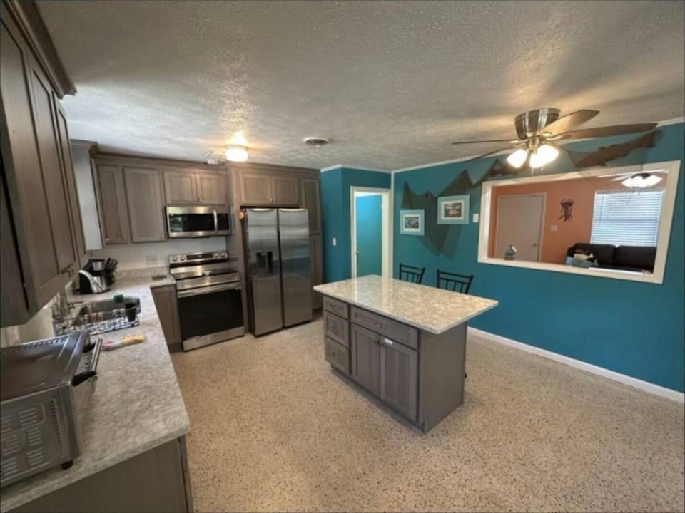 Kitchen looking into living room