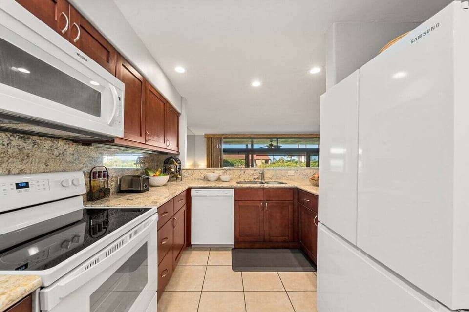 Fully equipped kitchen with ample counter space and elegant finishes for easy meal prep