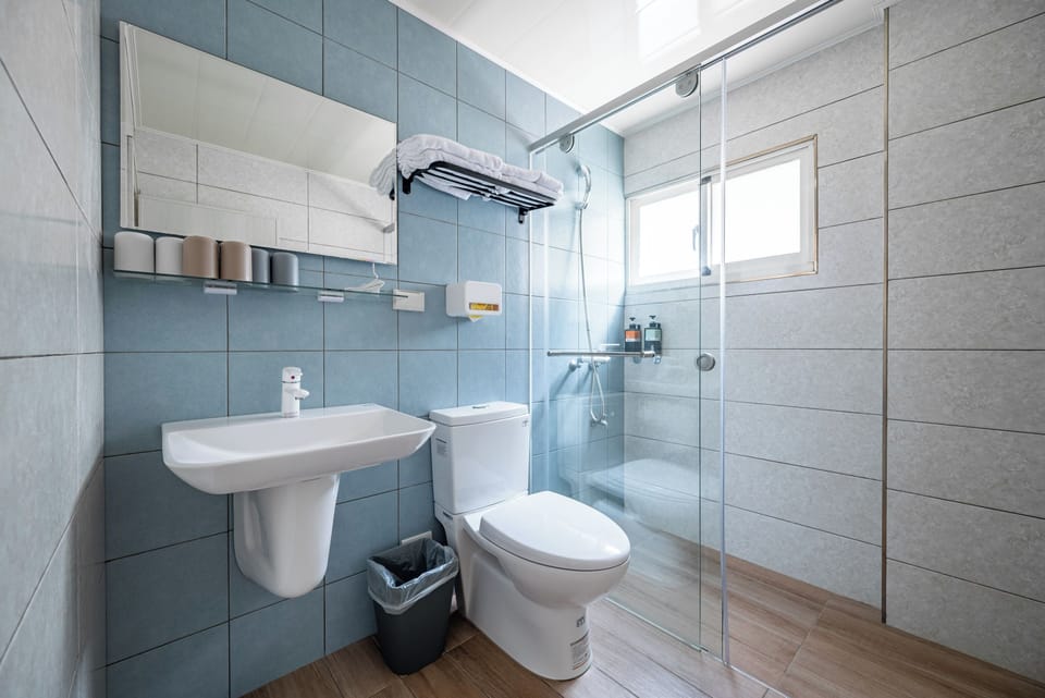 Family Room, Balcony | Bathroom | Shower, hair dryer, slippers, towels