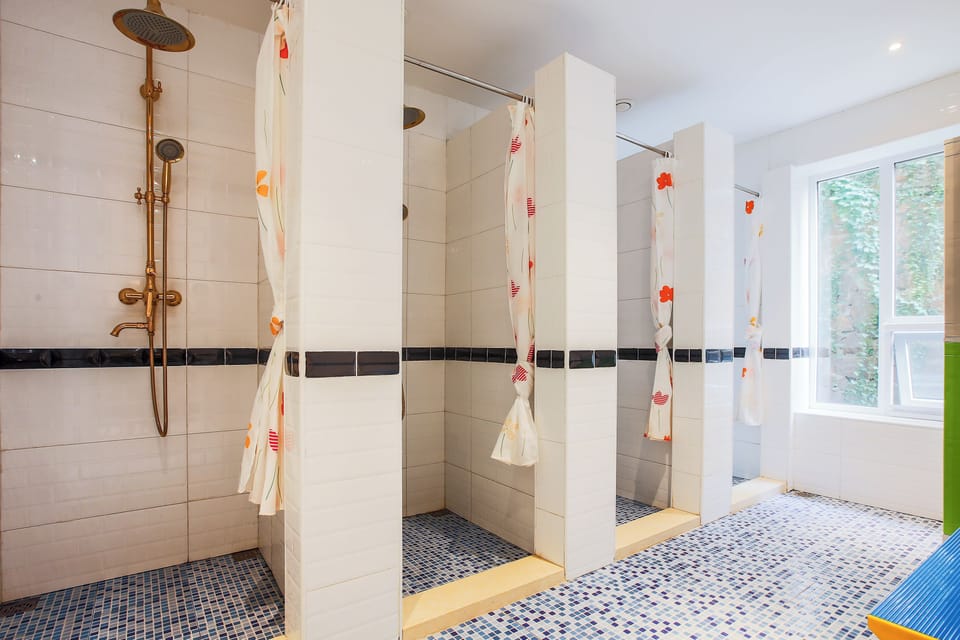 Shower, rainfall showerhead, designer toiletries, hair dryer