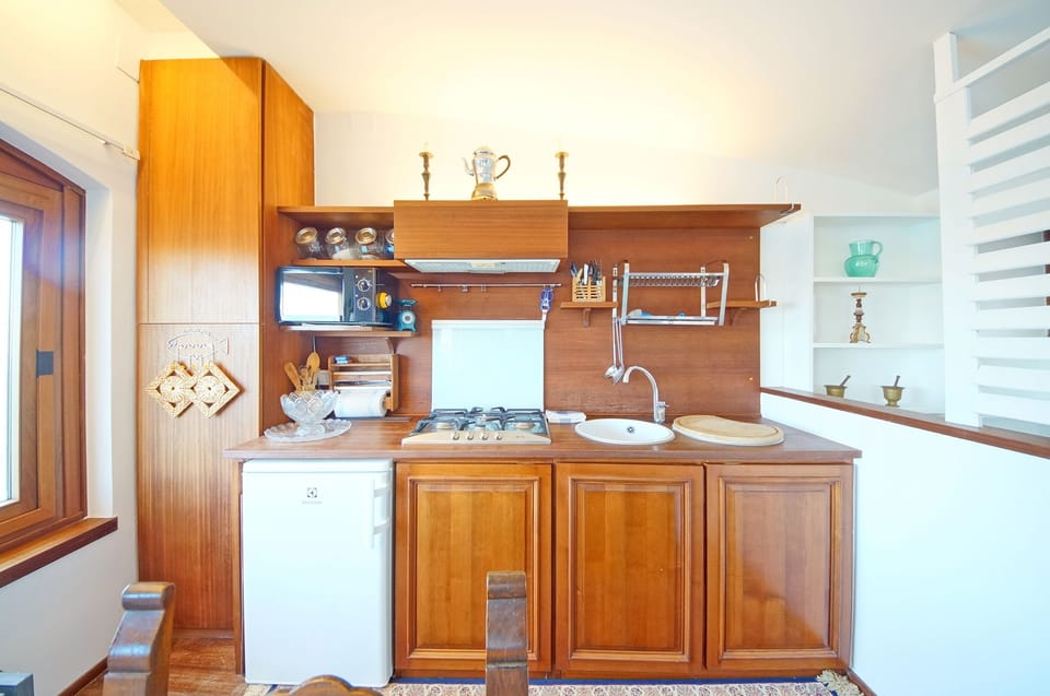 Apartment | Private kitchen | Full-size fridge, microwave, stovetop, electric kettle