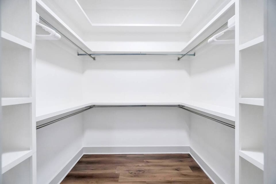 Primary suite walk-in closet w/ plenty of room to unpack & settle in.

