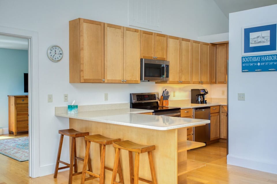 kitchen peeking into 1st floor king bedroom