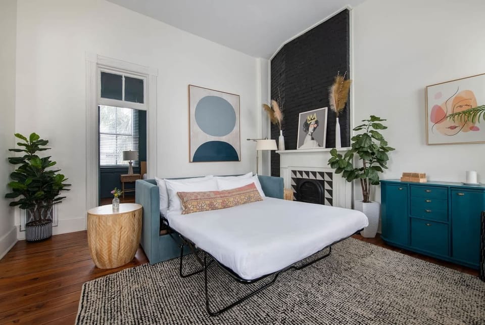 Living room space with a sofa bed 