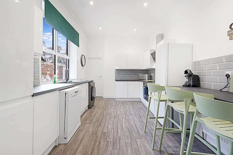 Family-friendly kitchen oasis equipped with all essentials, including a washer & dryer, oven, fridge and full cookware set. Plus, a 3-seater breakfast bar that ensures everyone feels right at home in this cozy culinary haven.