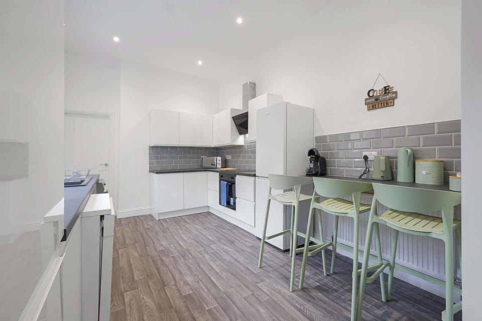 Fuel up before heading out from this spacious, well-lit kitchen, equipped for everything from morning coffee to quick meals. The open layout and generous workspace make preparing food simple, convenient and comfortable during your stay.