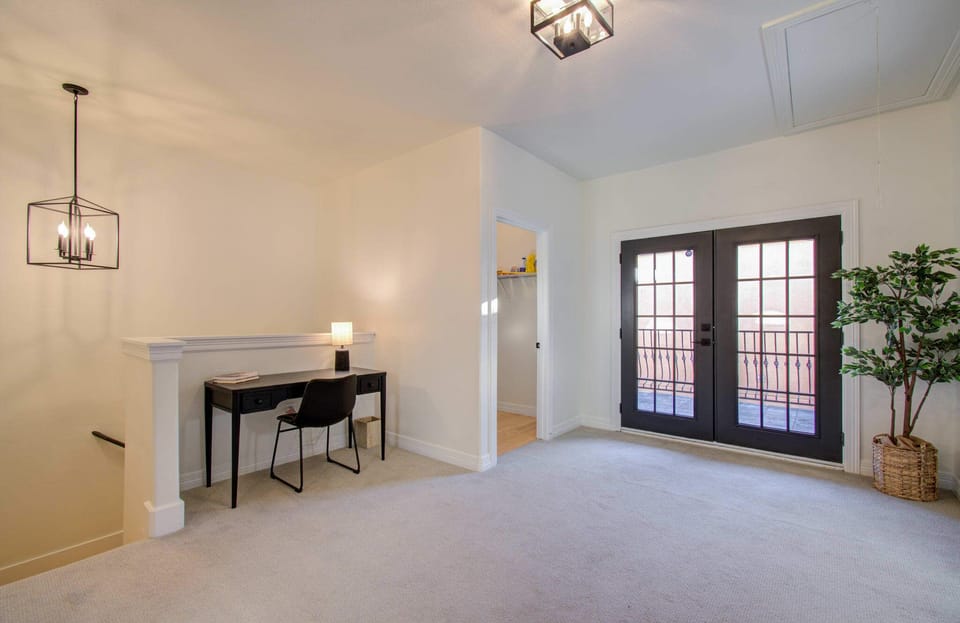 Looking for a quiet space to catch up on some work or studying? This dedicated work station includes a desk, lamp, and chair.