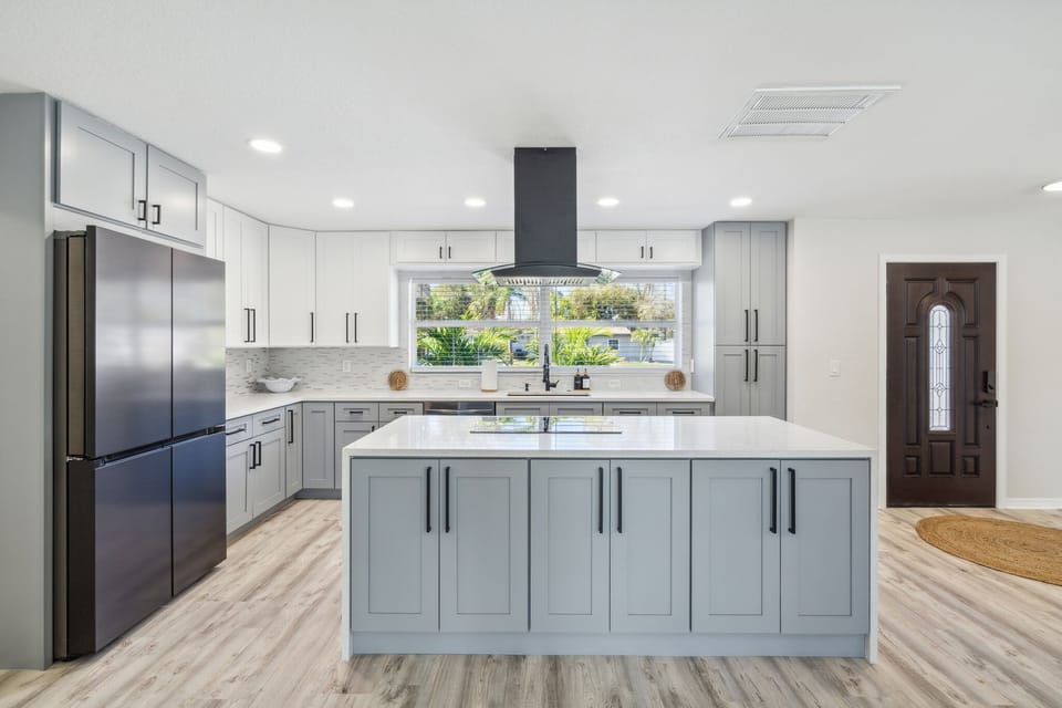 The beautiful kitchen is modern and updated, with lots of high-end finishes.