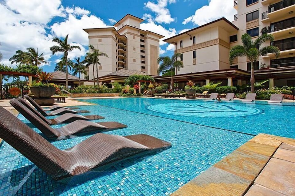 Lap Pool in the Beach Tower community, with chairs sitting in the shallows.