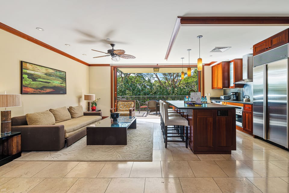 Relax in your spacious open-plan living area where the kitchen, dining, and lounge flow seamlessly together. Step through sliding doors to your private balcony surrounded by lush tropical greenery.