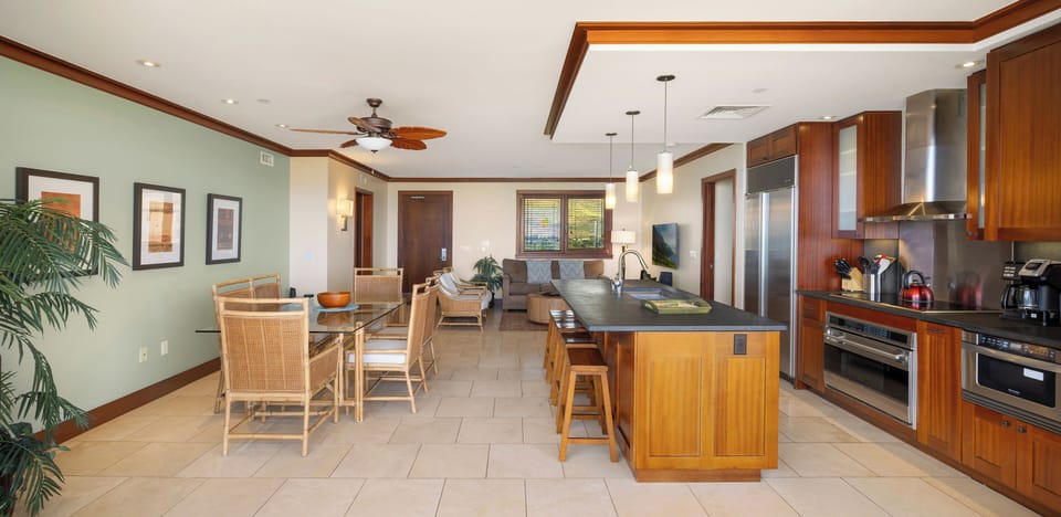 Your open-concept suite seamlessly blends gourmet kitchen, elegant dining space, and relaxing living area for effortless entertaining.