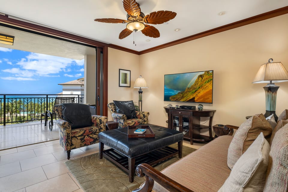 The living area has direct access to the lanai and ocean views.