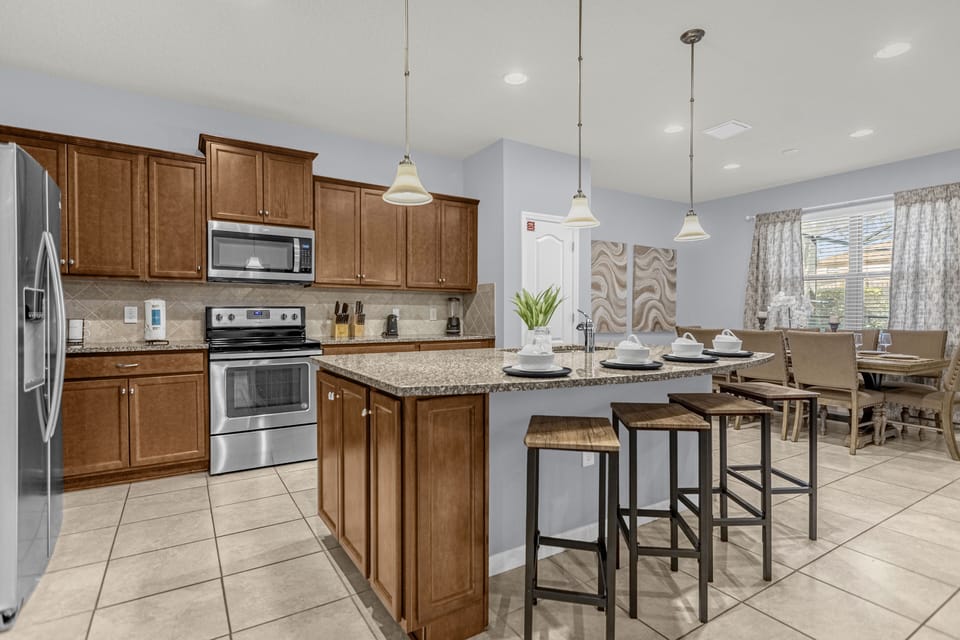 Stainless steel appliances, well stocked kitchen
