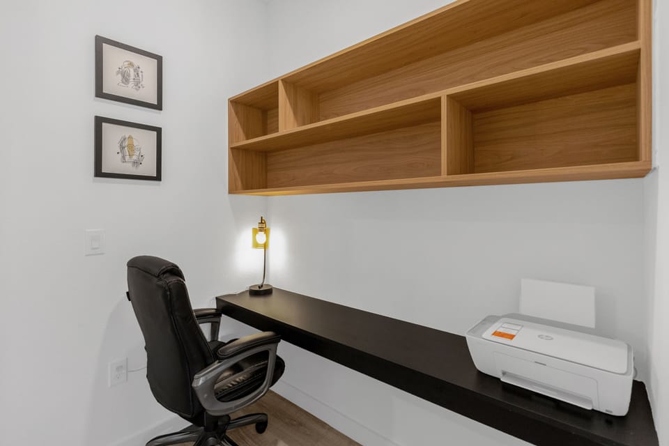 Private office space with printer in one of the bedrooms