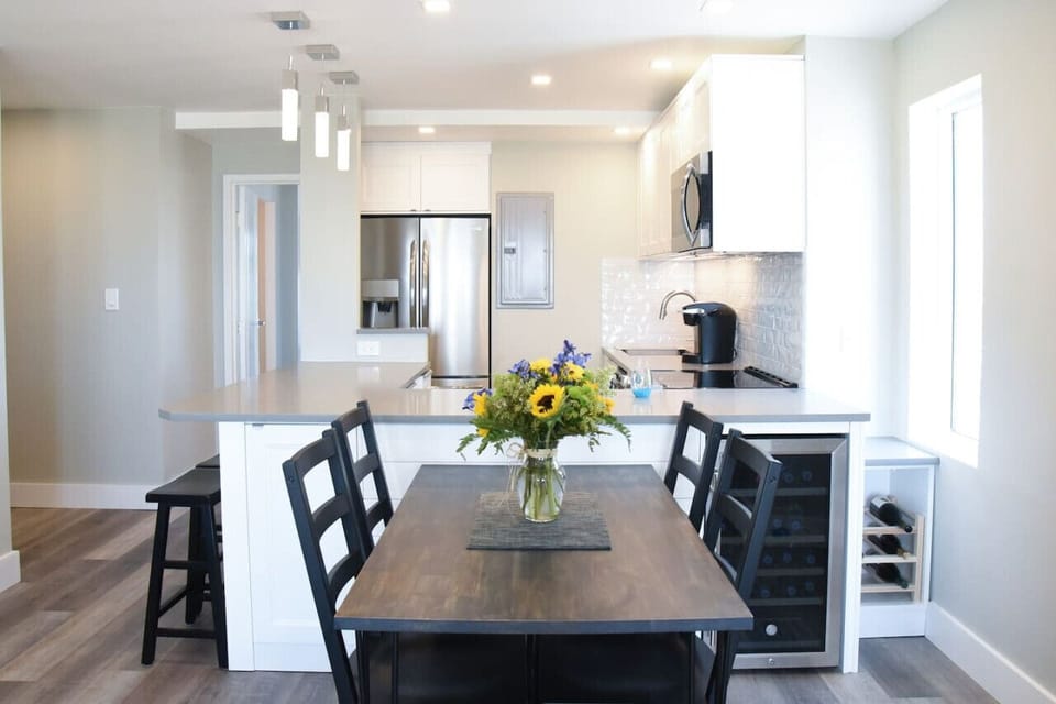 Gather, dine, and unwind, open-concept kitchen and dining space made for beach trips and easy nights in.