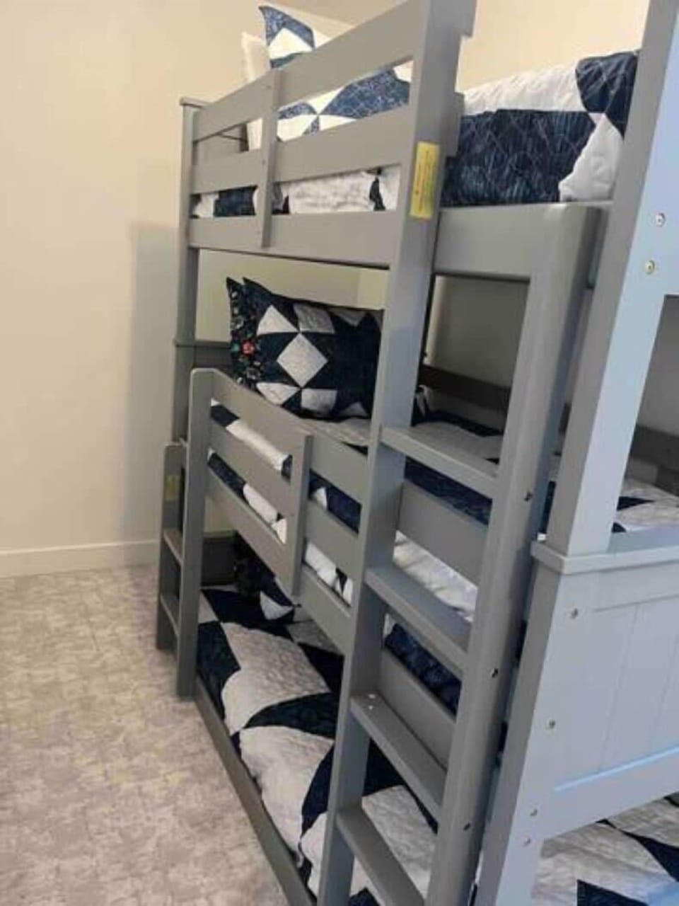 Triple bunk in basement. 