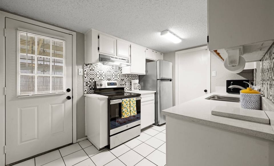 Spacious and Clean: The kitchen’s spacious counters and clean design make cooking and cleaning up a breeze.
