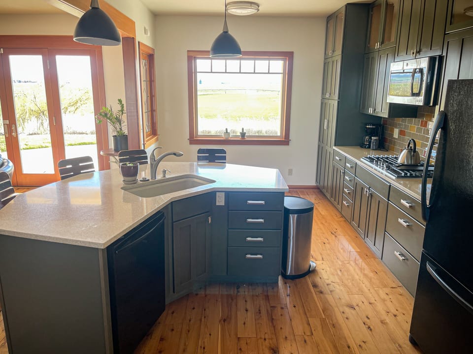 Gourmet kitchen, fully equipped with great views