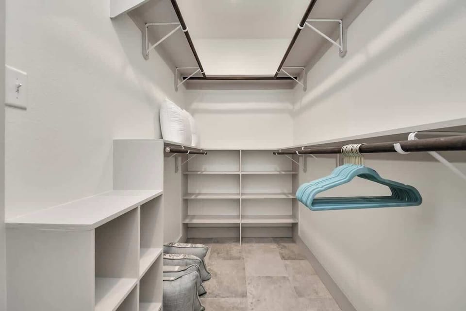 Spacious walk-in closet in Master Bathroom. Perfect storage space for those long term stays. 