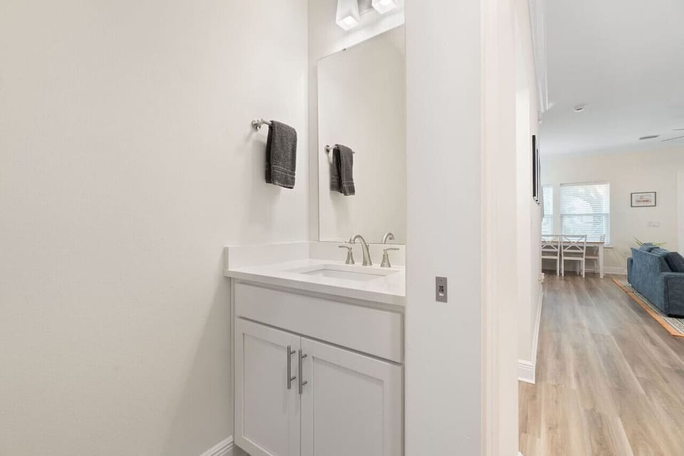 Half bathroom located next to the kitchen/living area for guests to use.