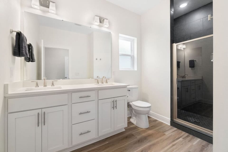 Master bathroom with double vanity and beautiful tiled shower. Attached to master bedroom. High quality soap and shampoo (Everyone for Everybody brand.. no parabens, dyes, phthalates, or artificial fragrance.) Hair dryer available.