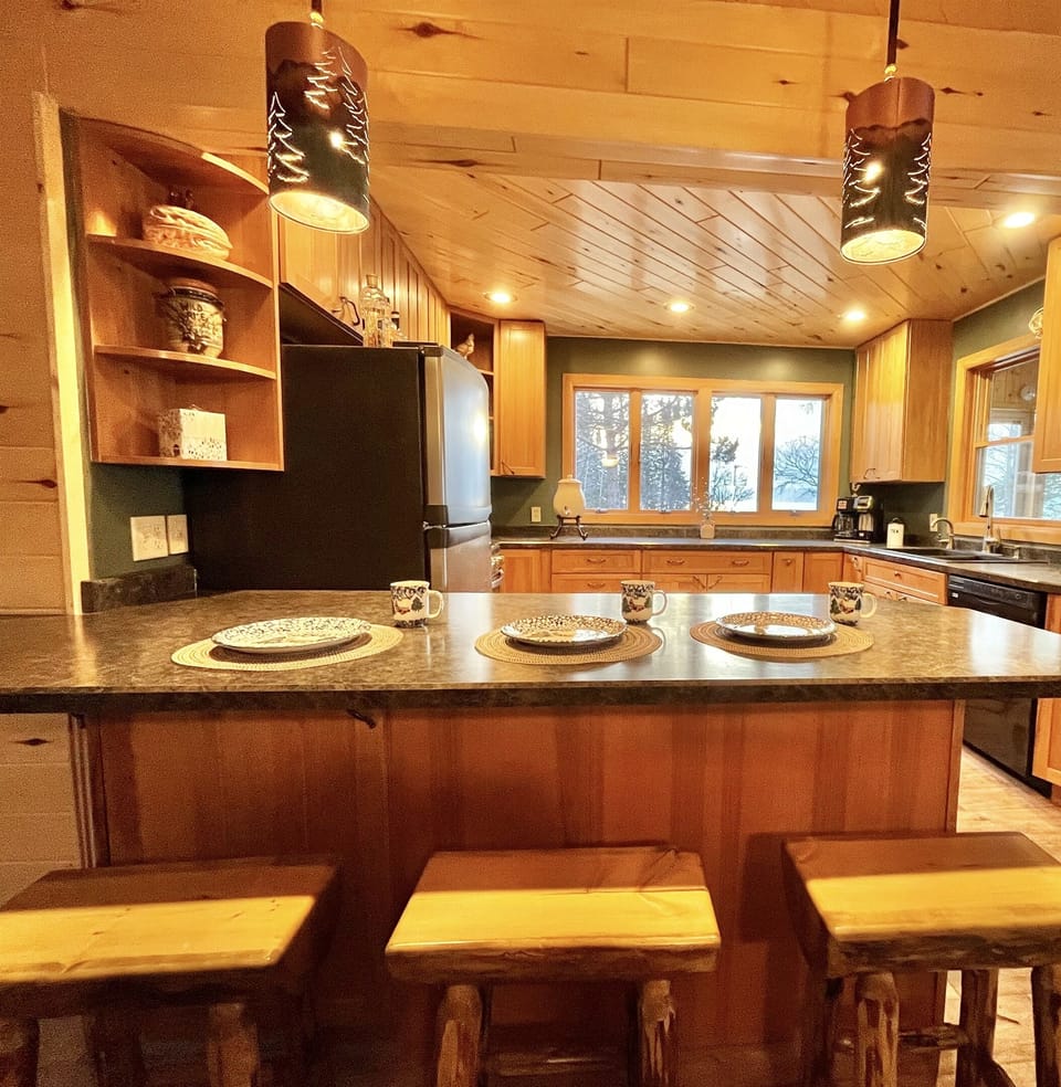 There is additional dining space at the kitchen counter.