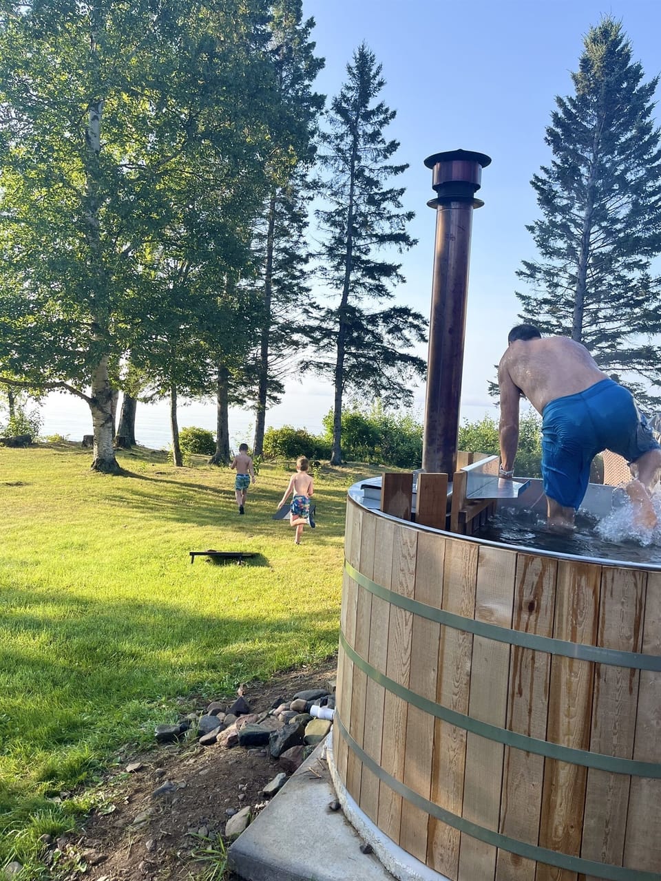 Invigorate yourself by jumping out of the wood-fired hot tub to cold plunge in Lake Superior.