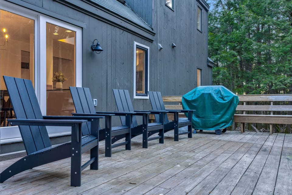 Deck with Adirondack chairs and outdoor grill