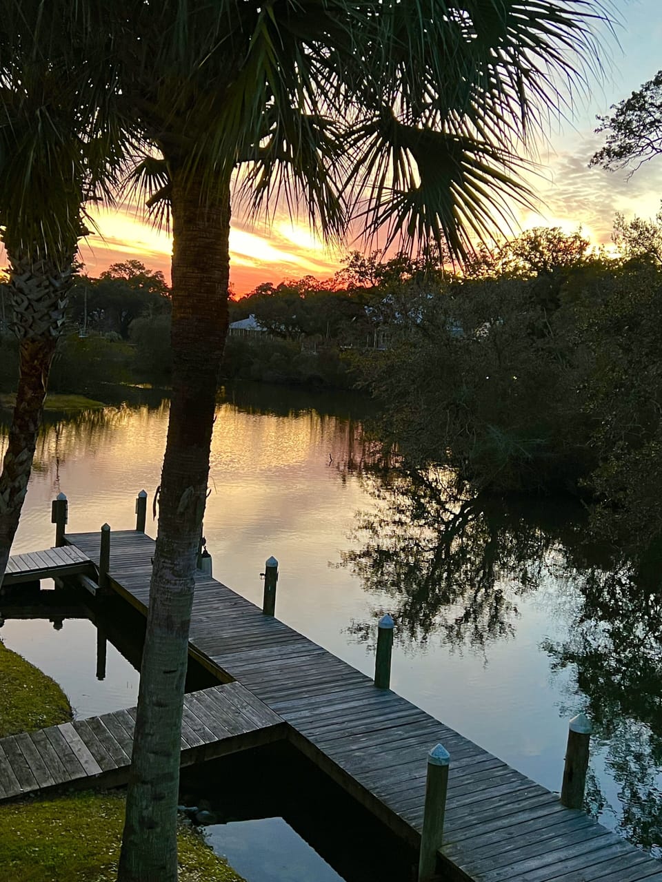 The balcony sunset view of the Bon Secour River waterfront 🍷