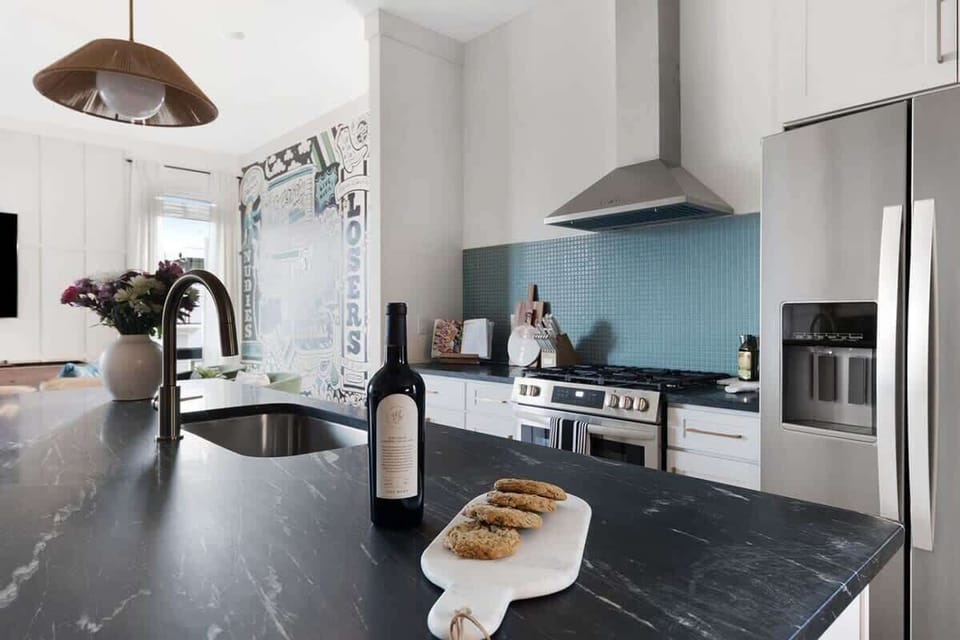Fully Stocked Kitchen with Modern Appliances and Ample Storage
