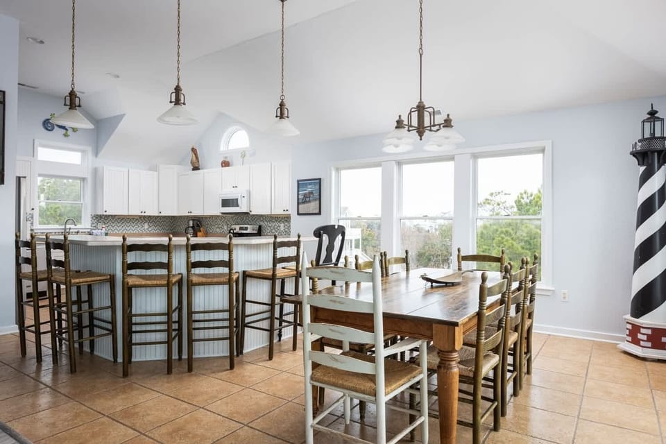 Dining Area and Kitchen with Bar Seating and Plenty of Space for Family Meals and Conversation.