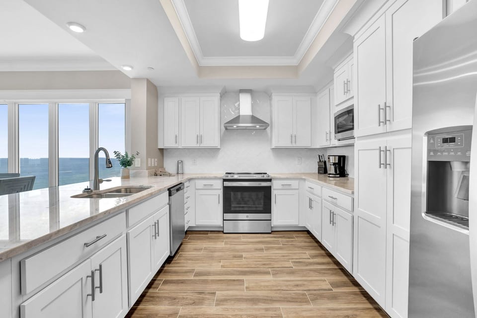 Prepare meals in this upgraded kitchen with modern appliances, elegant cabinetry, and stylish countertops