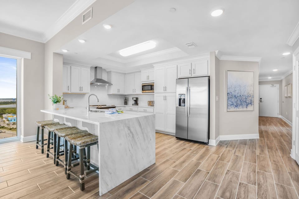 Savor your morning coffee overlooking this upgraded kitchen with elegant accents
