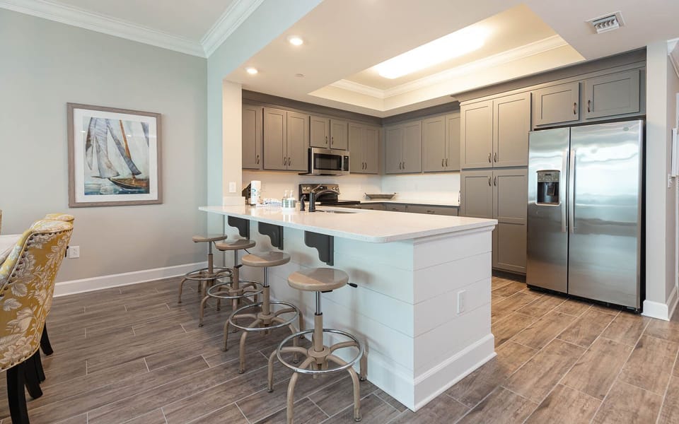 Enjoy your morning coffee at the breakfast bar overlooking this stylish kitchen