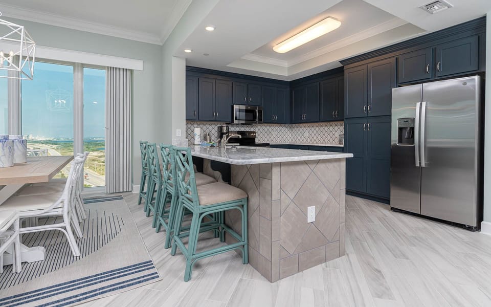 Sip your morning coffee at the breakfast bar and get ready for a beach day in this stylish space