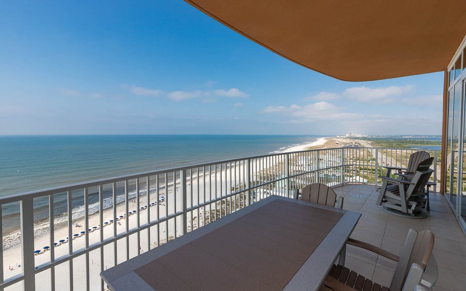 Experience seemingly endless coastline views from your corner balcony as waves lap the shore